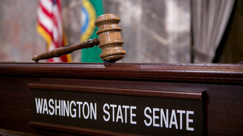 A gavel above a "Washington State Senate" name plate
