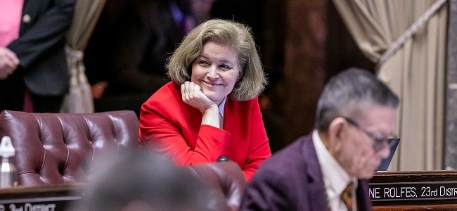 Senator Christine Rolfes smiles on the senator floor in Olympia